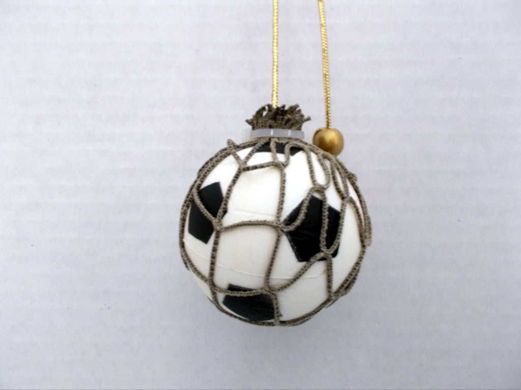 Jewelry Cord hanger to display a miniature soccer on a vehicle's rear vier mirror.